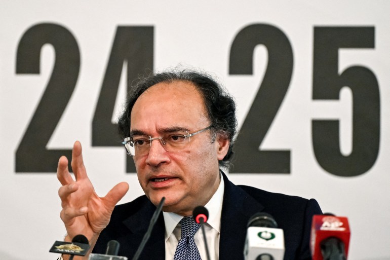Minister of Finance Muhammad Aurangzeb addresses investors in Islamabad.
