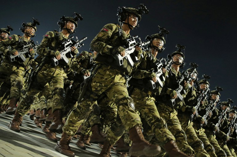 Soldiers participate in a military parade in Pyongyang