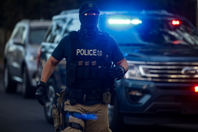 ICE officials arresting an illegal immigrant