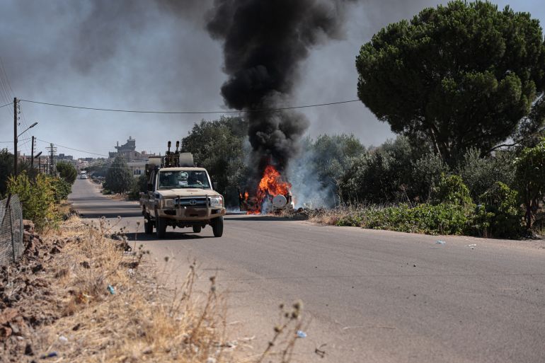 Véhicule en flammes lors des affrontements à Soueida, 16 juillet 2025