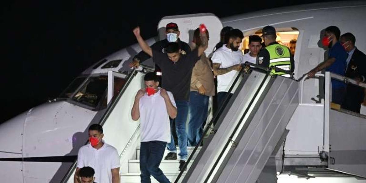 Avion transportant des migrants vénézuéliens à leur arrivée au Venezuela