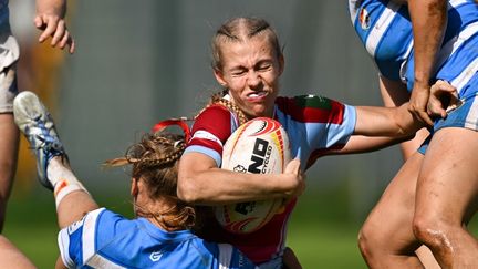 Un match de rugby à 7 du championnat allemand, le 1er août 2025. (HENDRIK SCHMIDT / DPA / AFP)